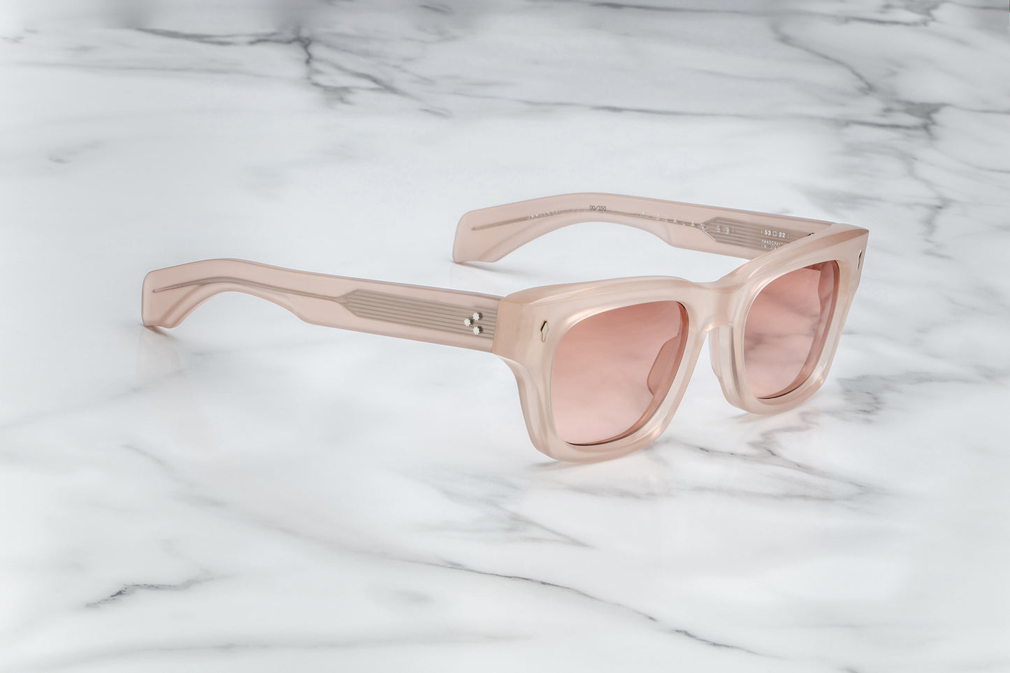 Side view of light pink rectangular sunglasses