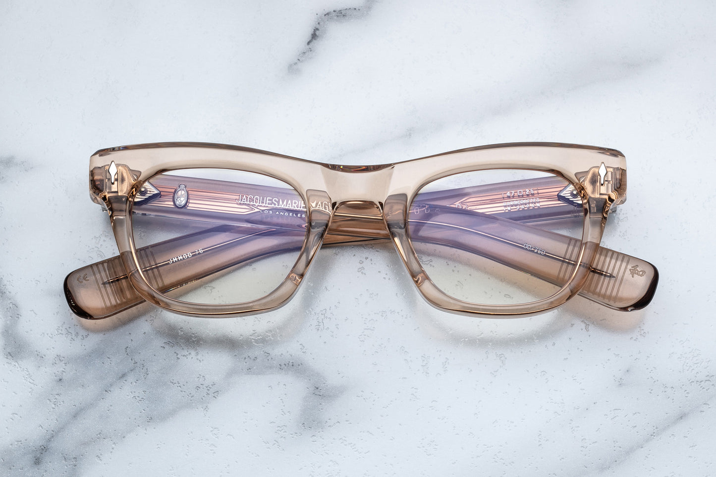 Overhead view of translucent beige square eyeglasses