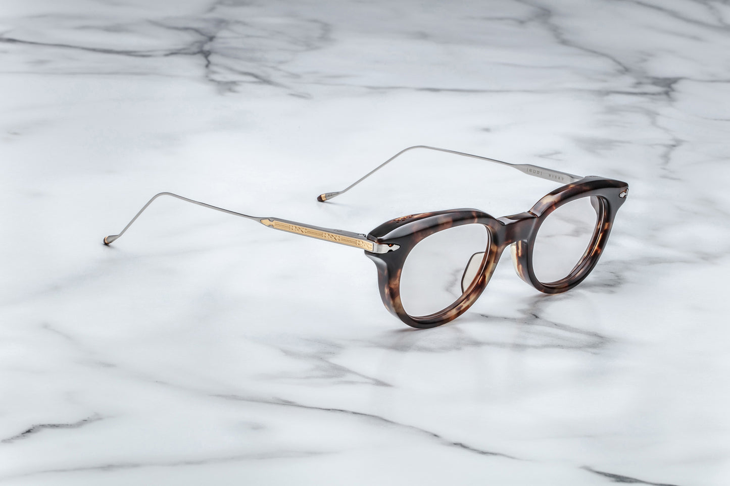 Profile view of round tortoise-patterned glasses