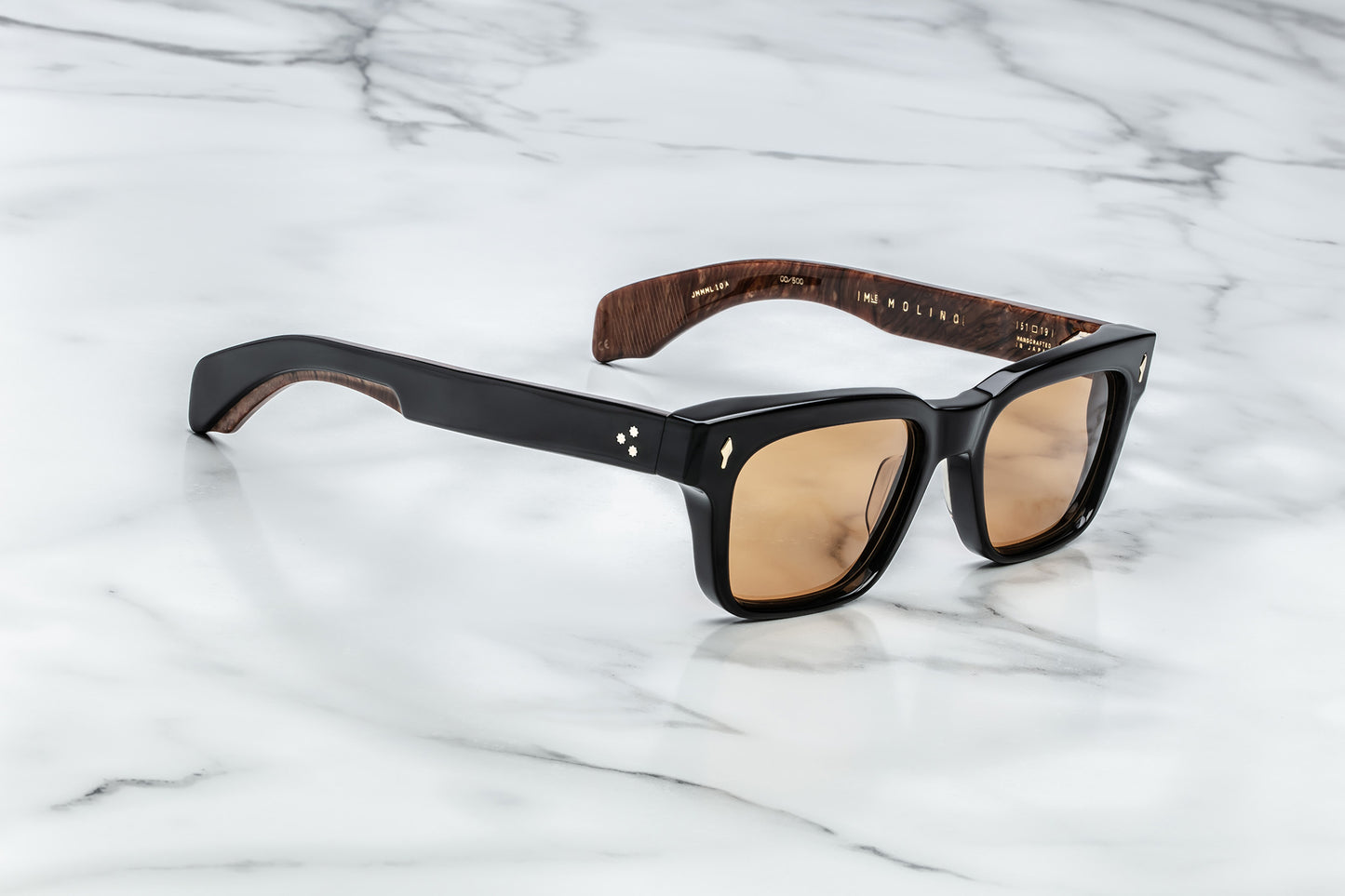 Side view of black rectangular sunglasses with brown orange lenses