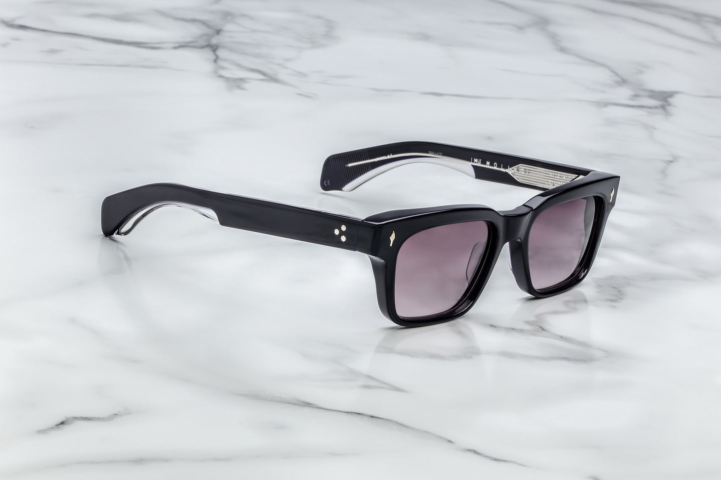 Side view of black rectangular sunglasses with purple lenses