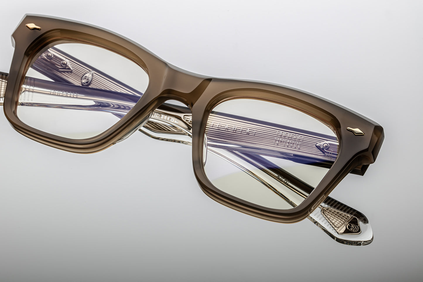 Rectangular eyeglasses with brown grey frames and silver accents