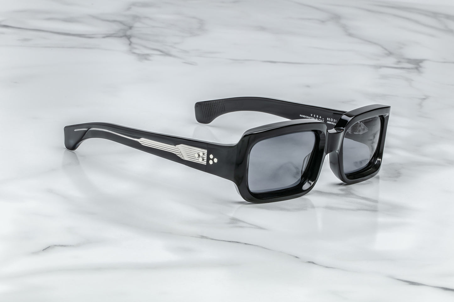 Side view of black rectangular sunglasses with black lenses