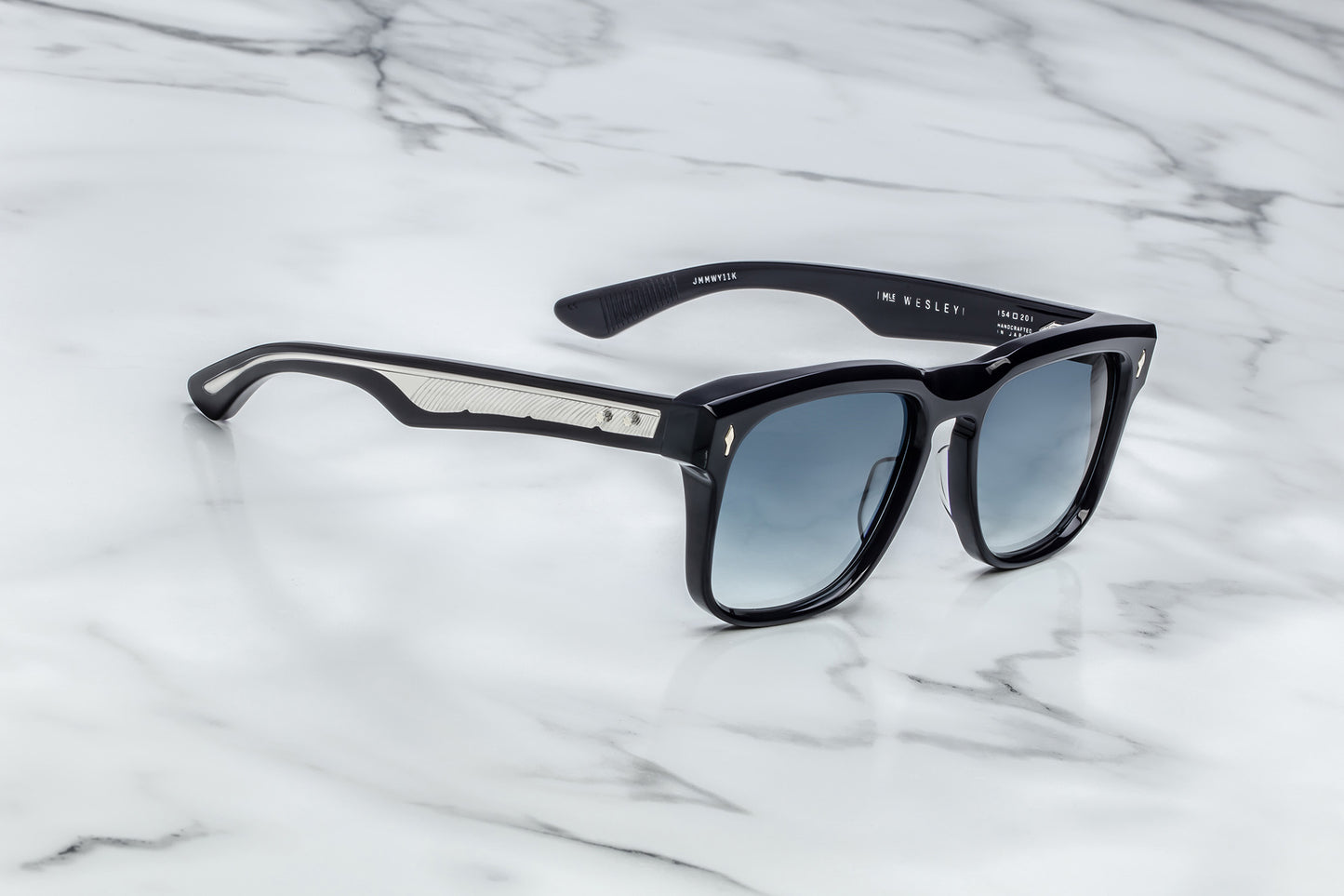 Side view of black rectangular sunglasses with blue lenses