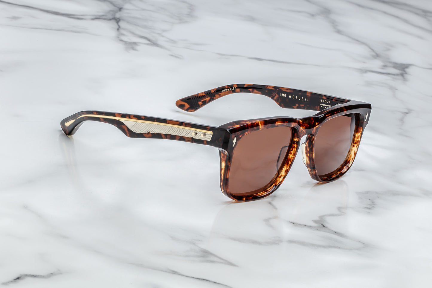 Side view of brown tortoise shell patterned rectangular sunglasses with brown lenses