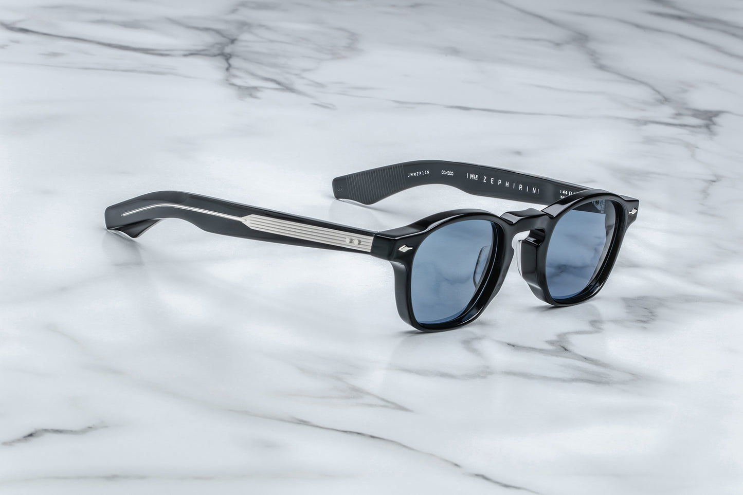 Side view of black rounded rectangular sunglasses with blue lenses