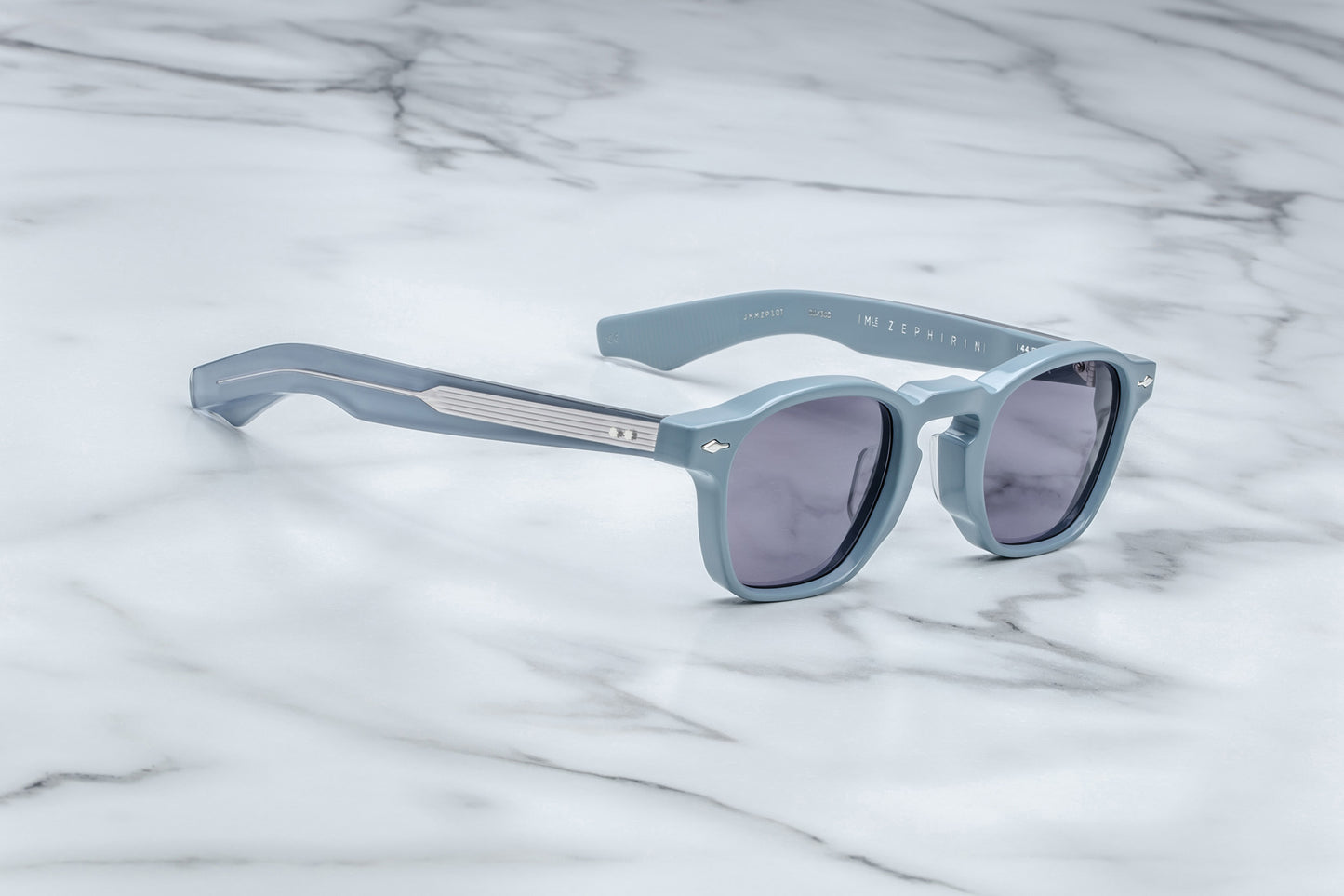Side view of powder blue rounded rectangular sunglasses with purple lenses
