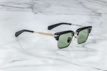 Side view of silver rectangular sunglasses with green lenses