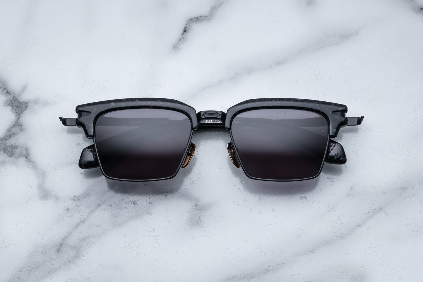 Overhead view of black rectangular sunglasses with black lenses