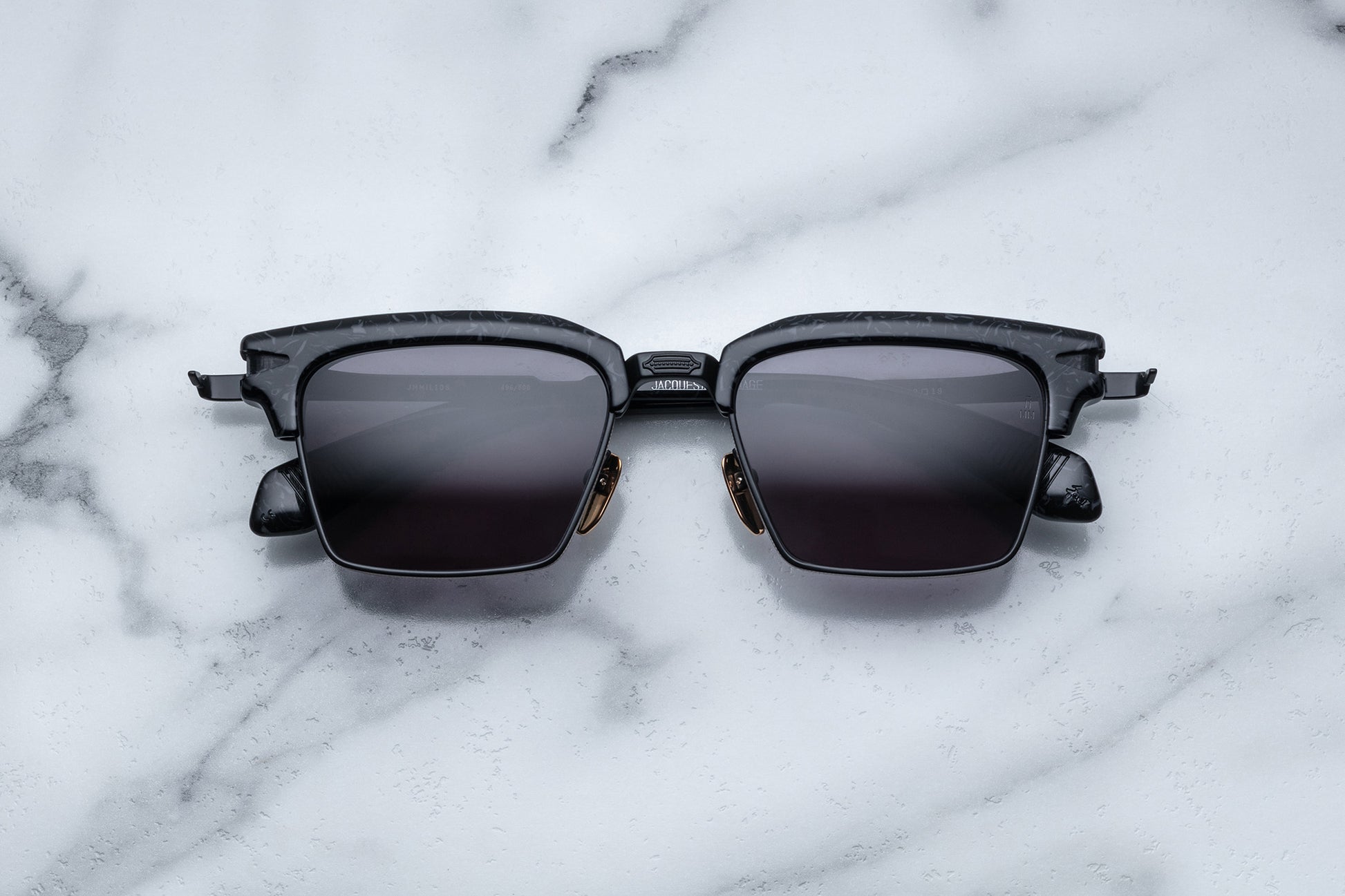 Overhead view of black rectangular sunglasses with black lenses