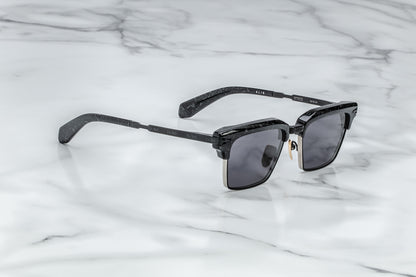 Overhead view of black rectangular sunglasses with black lenses