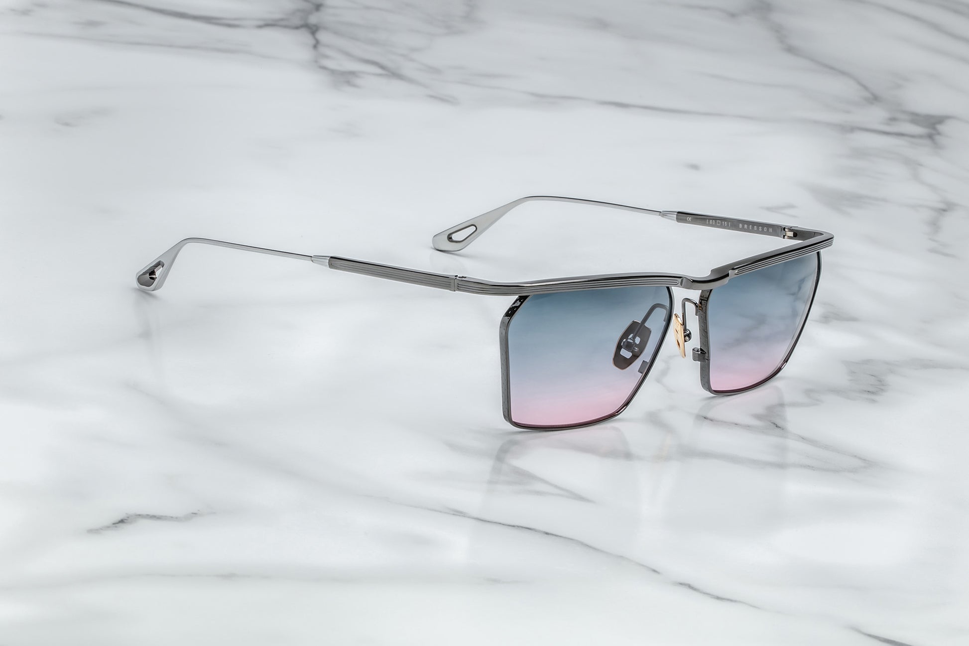 Side view of black sunglasses purple gradient lenses