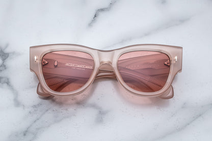 Overhead view of quartz pink sunglasses with light pink lenses