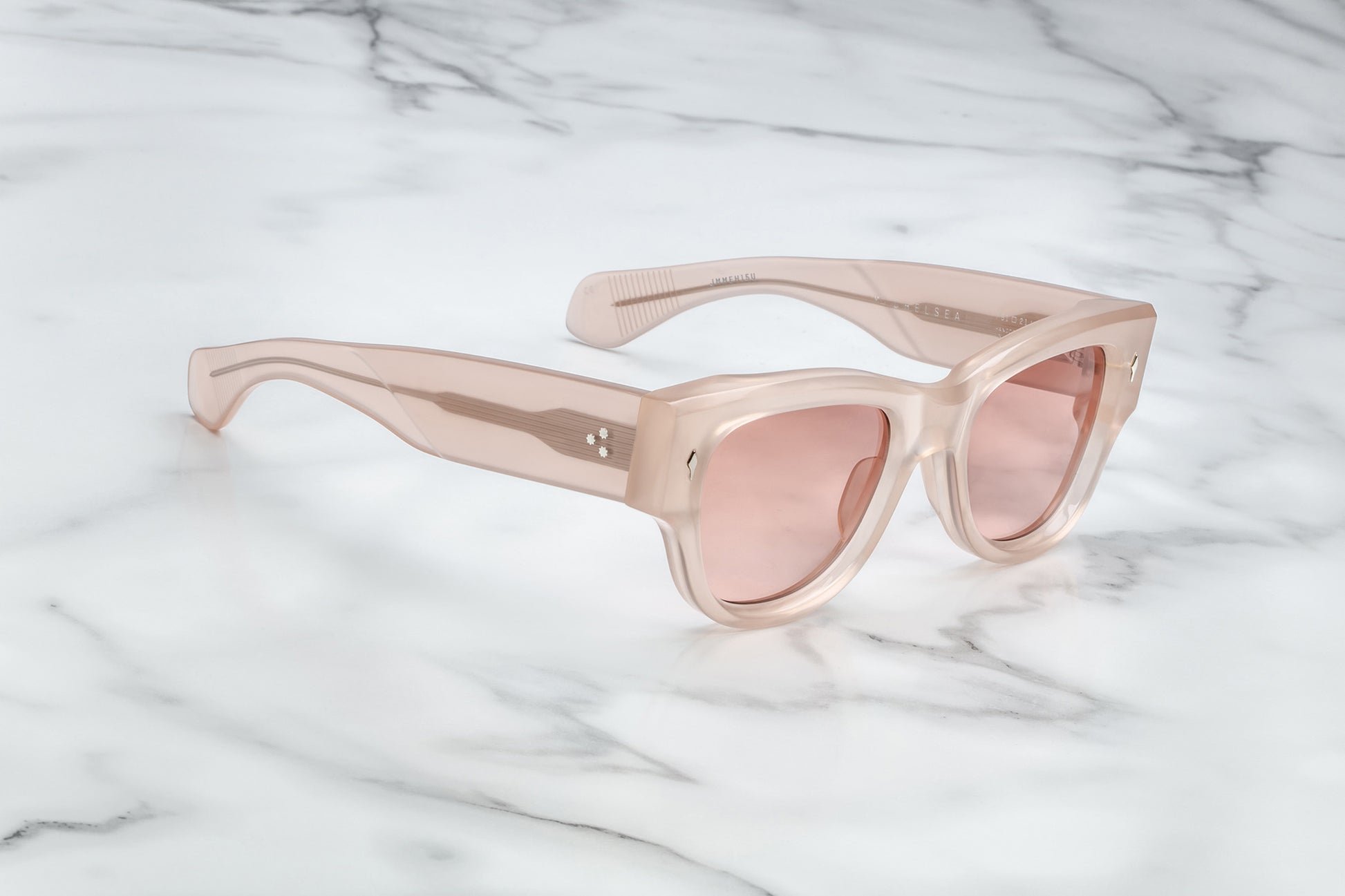Side view of quartz pink sunglasses with light pink lenses