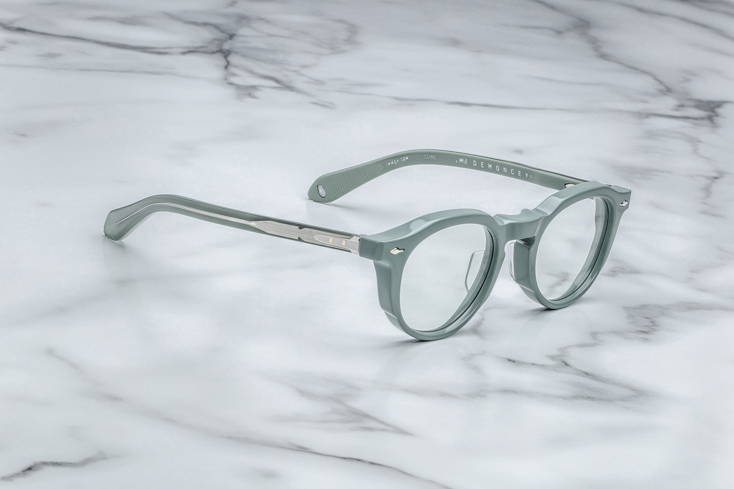 Side view of powder blue round eyeglasses with silver accents