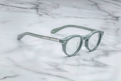 Side view of powder blue round eyeglasses with silver accents