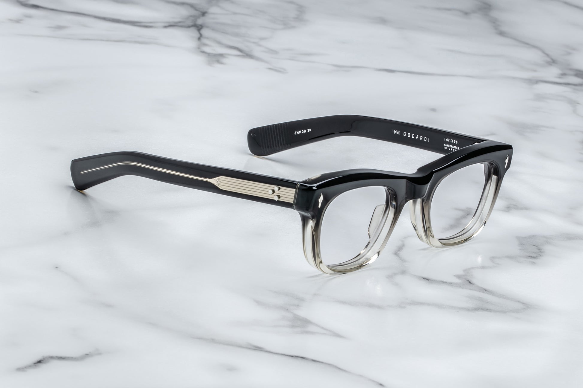 Side view of square eyeglasses with a black to clear vertical gradient