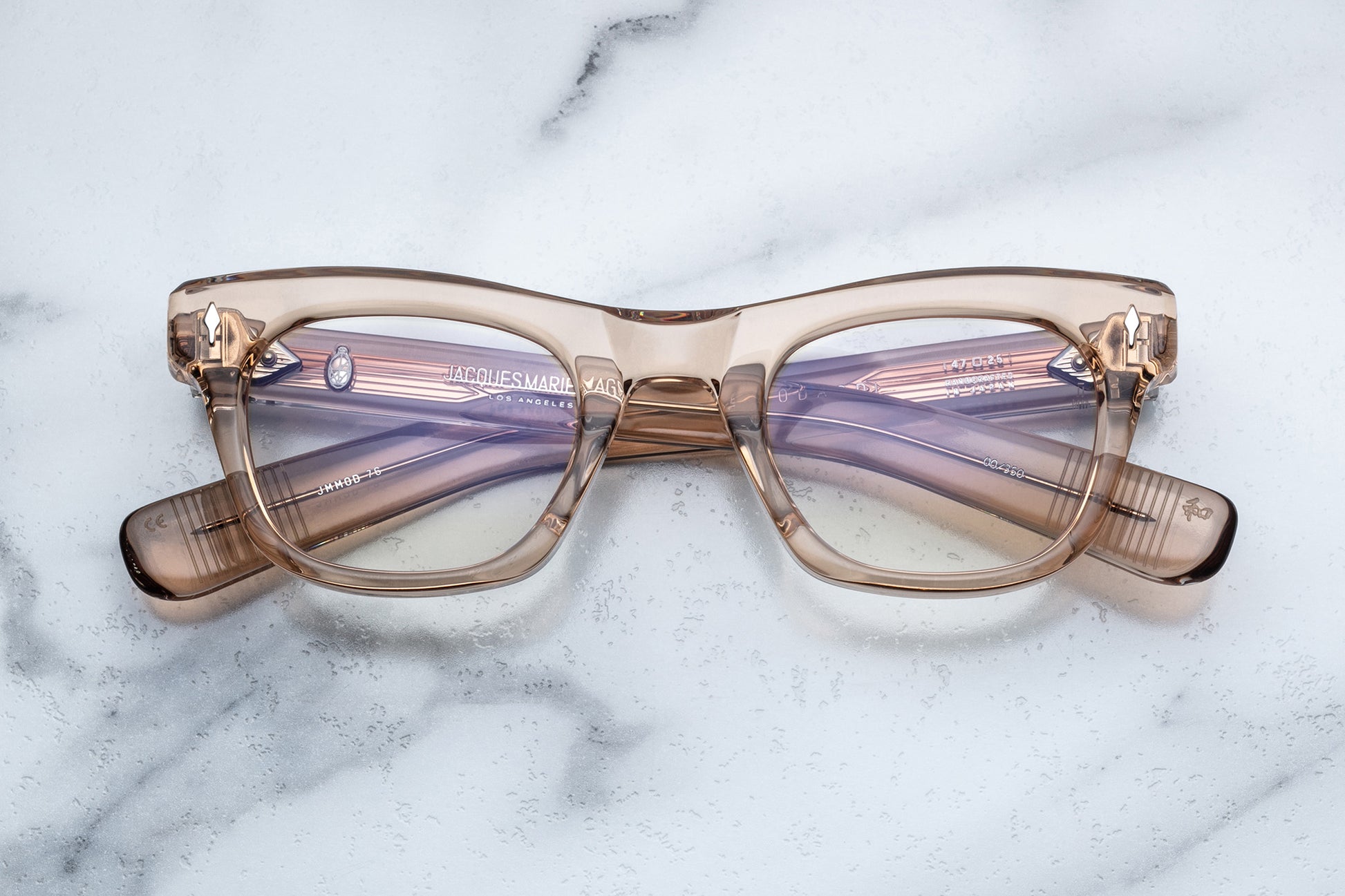 Overhead view of translucent beige square eyeglasses