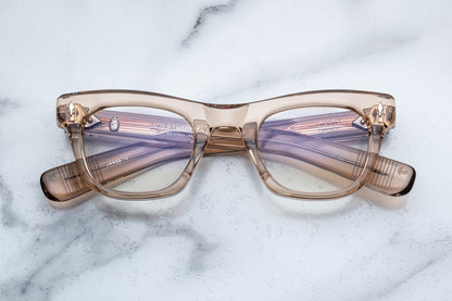 Overhead view of translucent beige square eyeglasses