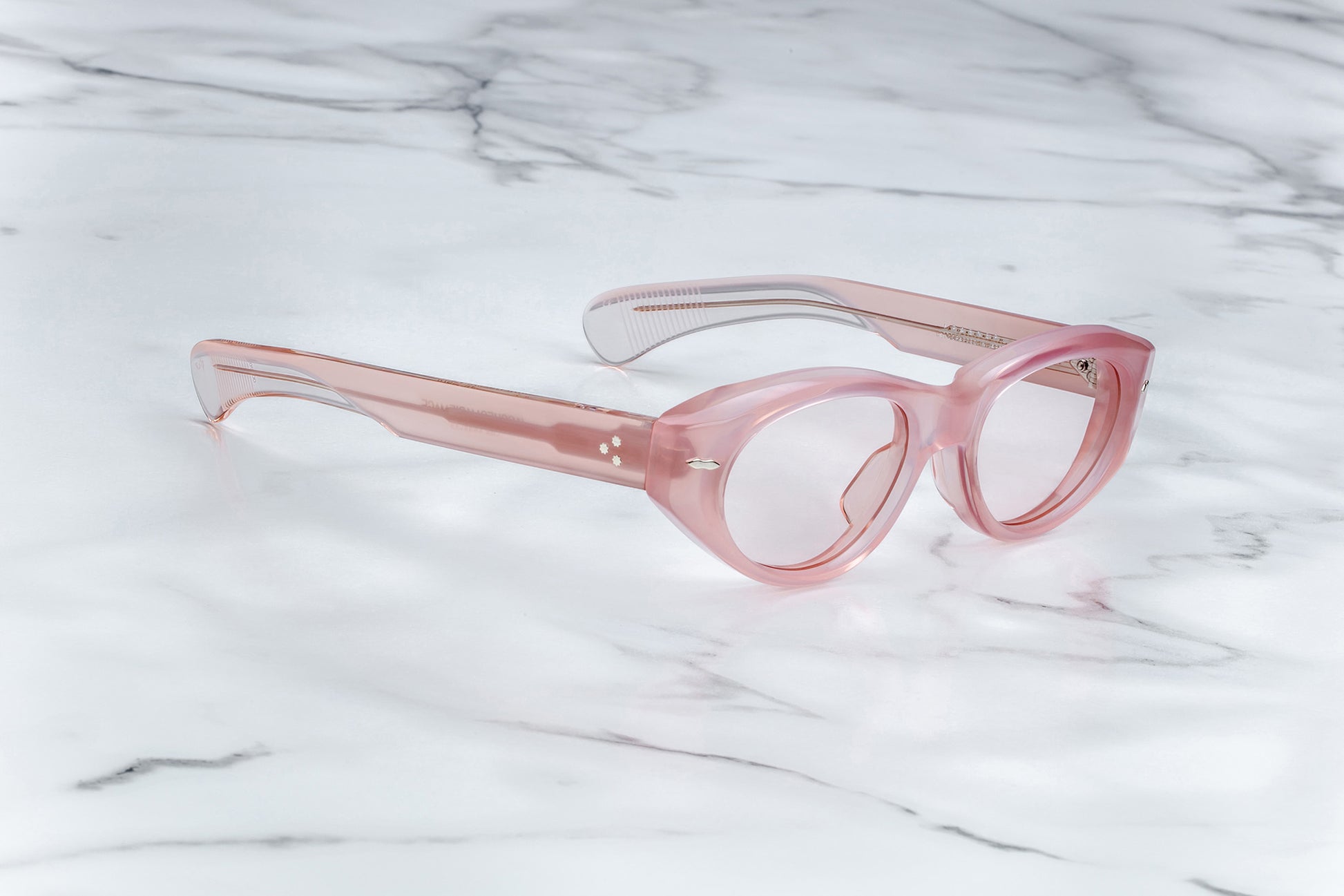 Profile view of light pink cat-eye classes with clear lenses