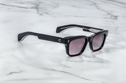 Side view of black rectangular sunglasses with purple lenses