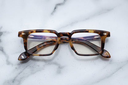 Overhead view of tortoise patterned reading glasses