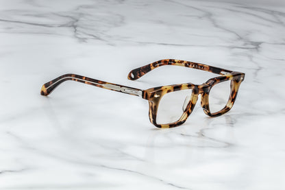 Side view of tortoise patterned reading glasses