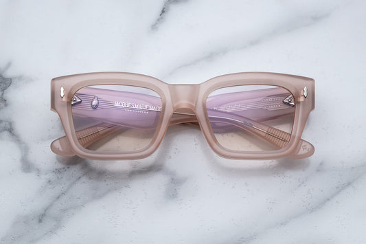Overhead view of light pink rectangular eyeglasses