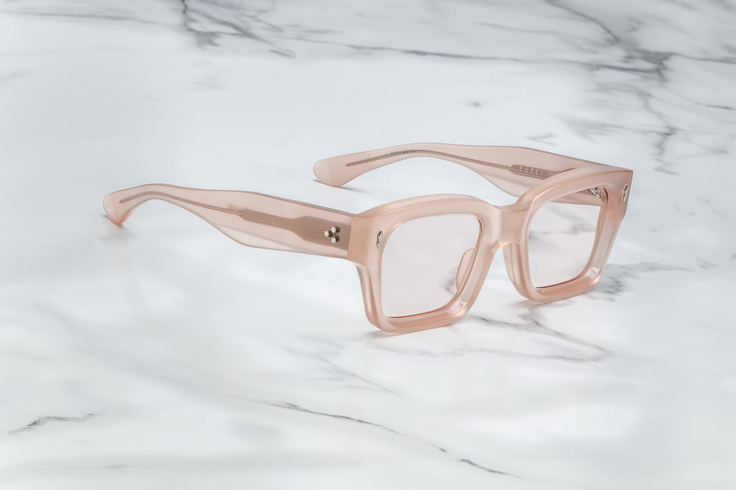 Side view of light pink rectangular eyeglasses
