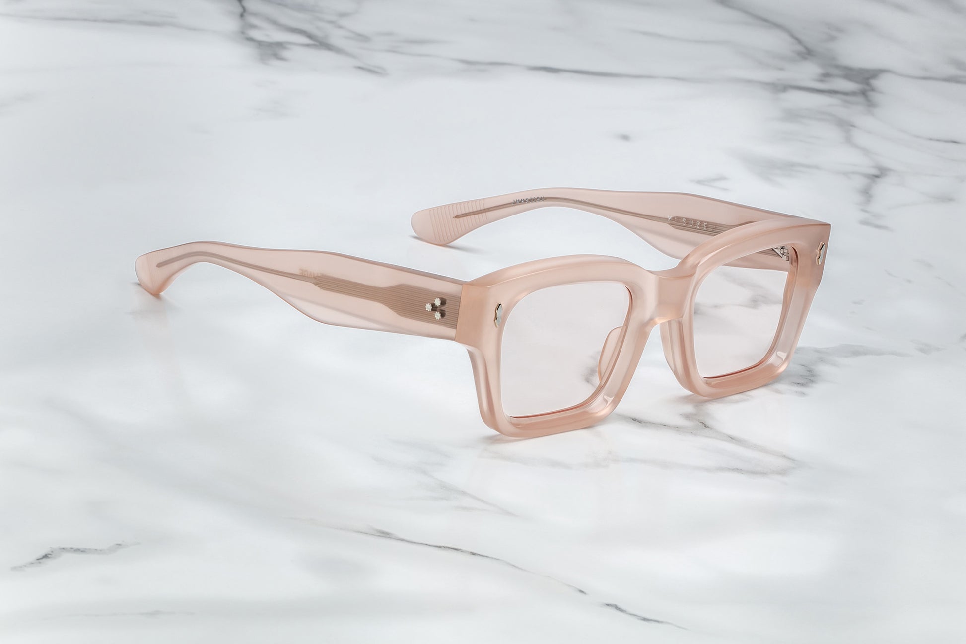 Side view of light pink rectangular eyeglasses