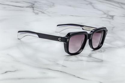 Side view of black sunglasses with purple lenses