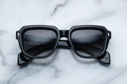 Overhead view of black sunglasses with black lenses