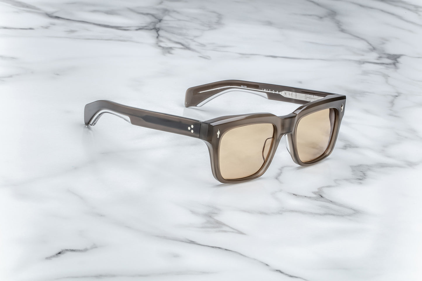 Side view of brown rectangular sunglasses with brown lenses