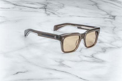 Side view of brown rectangular sunglasses with brown lenses