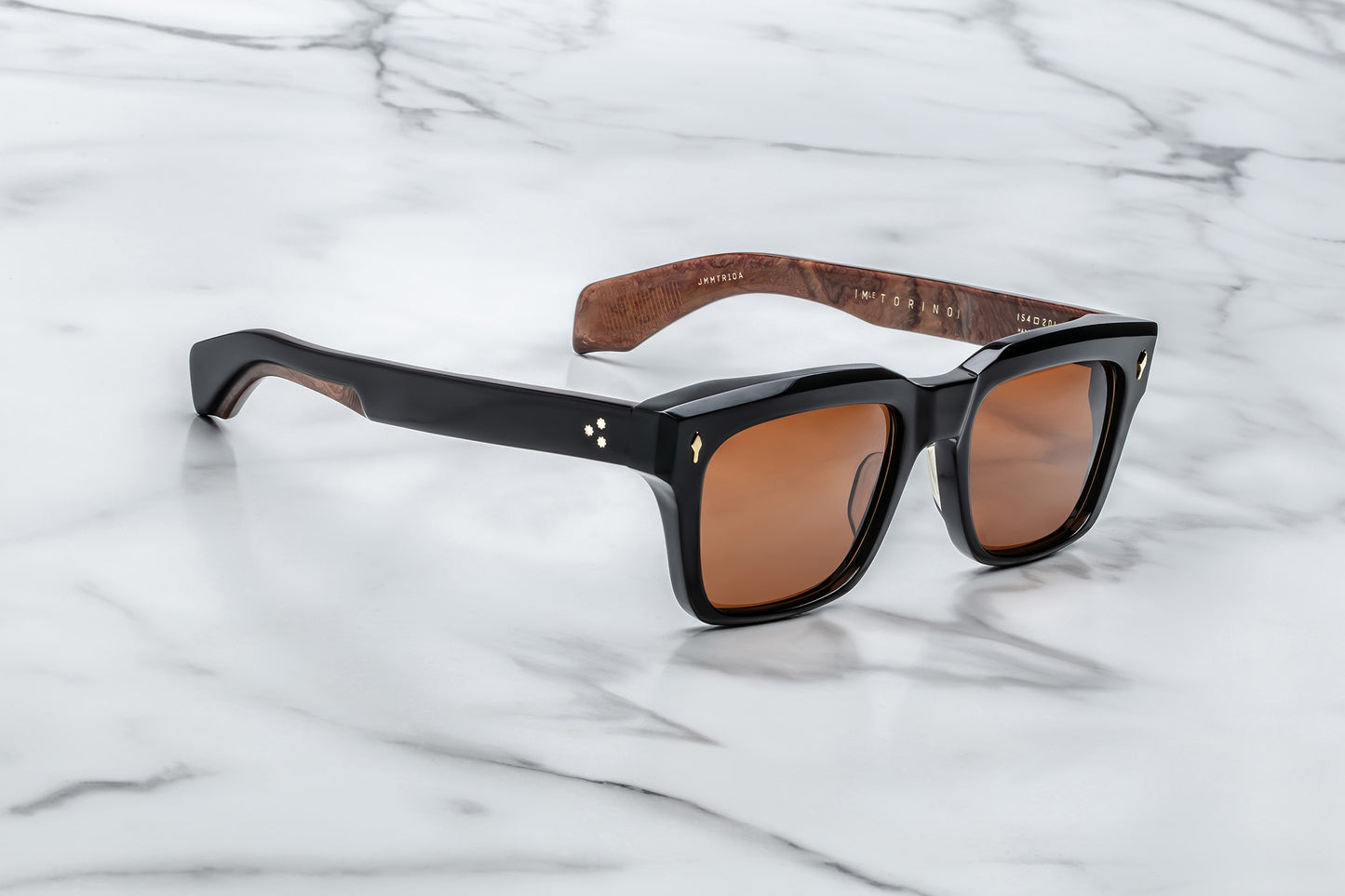 Side view of black rectangular sunglasses with orange lenses