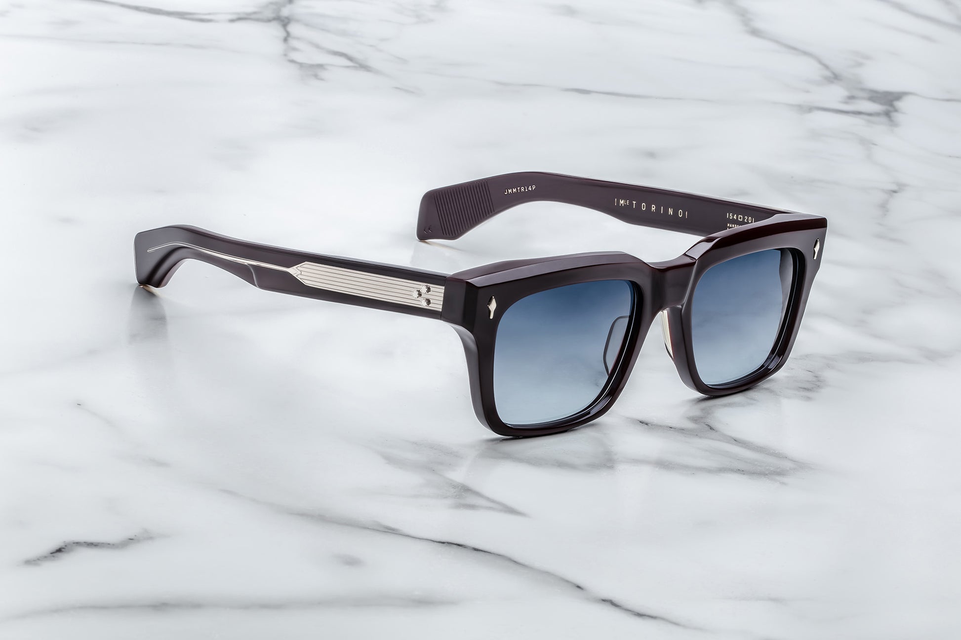 Side view of dark purple rectangular sunglasses with blue lenses