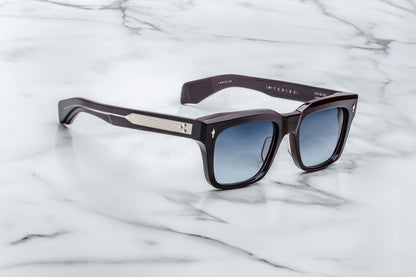 Side view of dark purple rectangular sunglasses with blue lenses