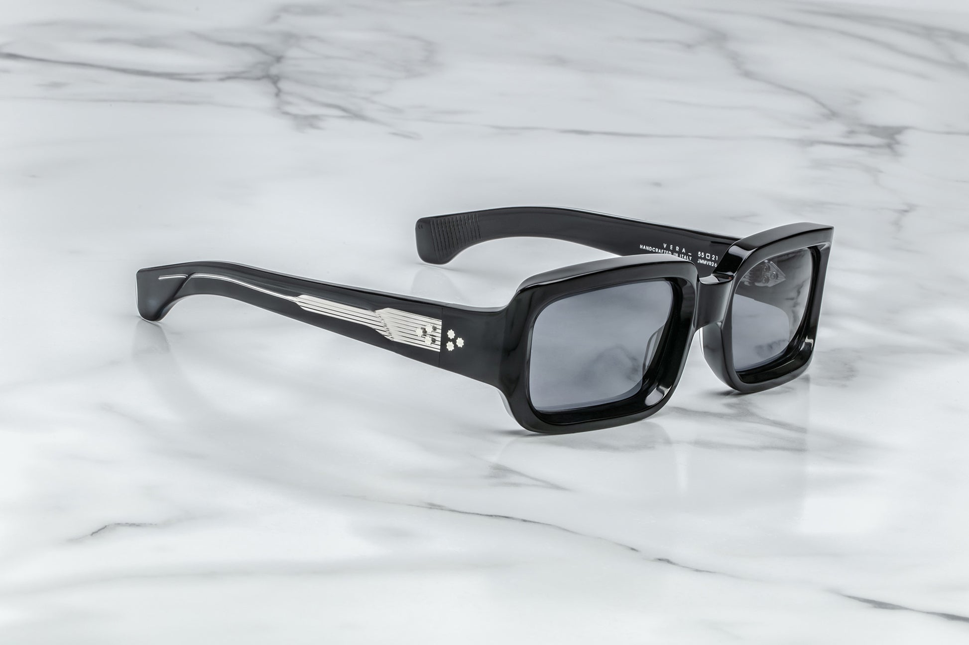 Side view of black rectangular sunglasses with black lenses