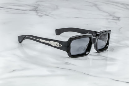 Side view of black rectangular sunglasses with black lenses