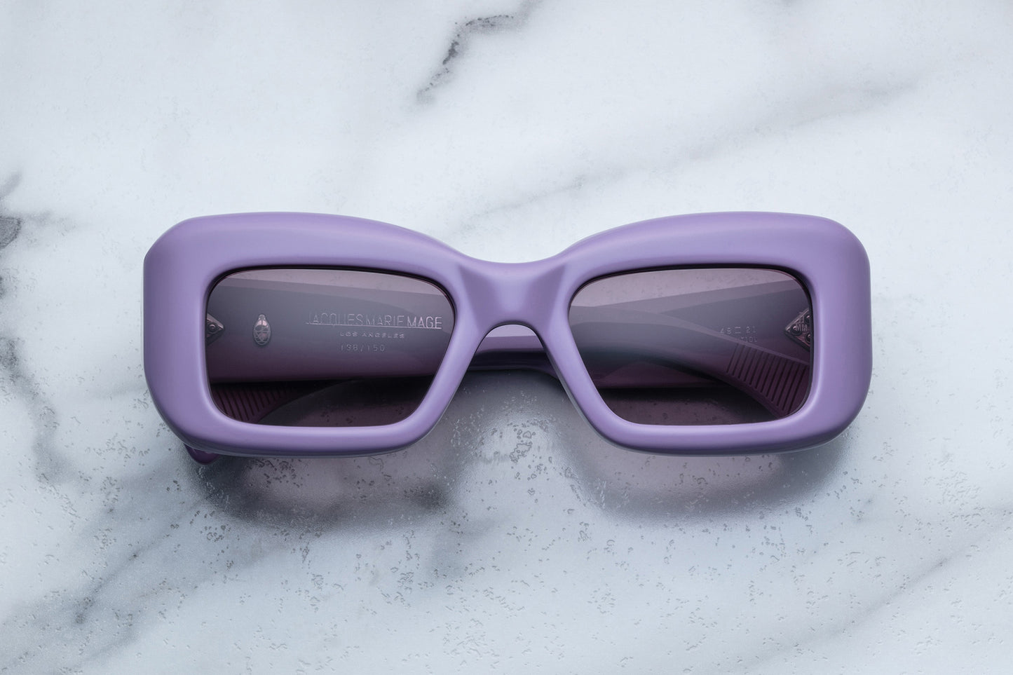 Overhead view of rectangular purple sunglasses