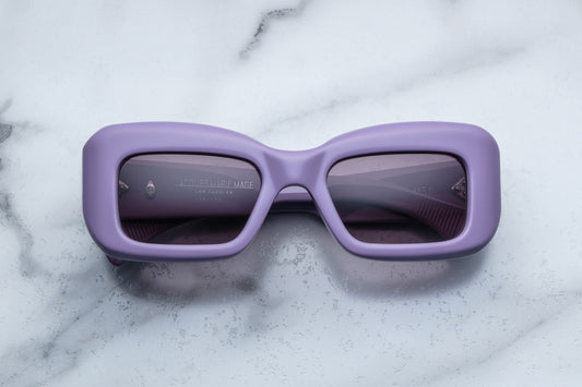 Overhead view of rectangular purple sunglasses