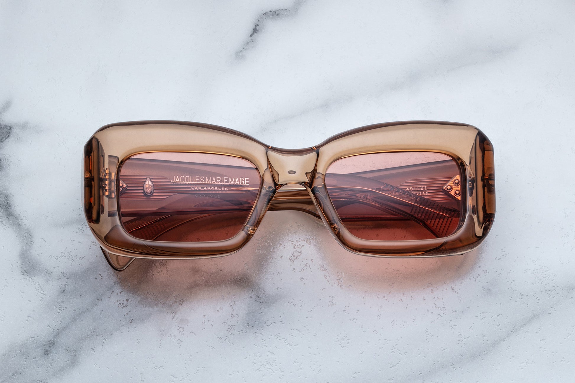 Overhead view of rose translucent sunglasses with pink lenses
