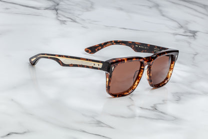 Side view of brown tortoise shell patterned rectangular sunglasses with brown lenses