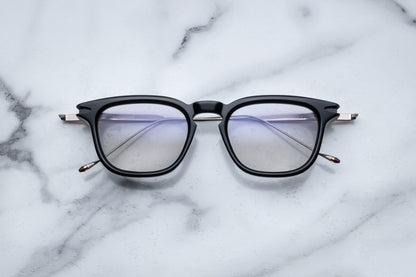 Overhead view of black round eyeglasses