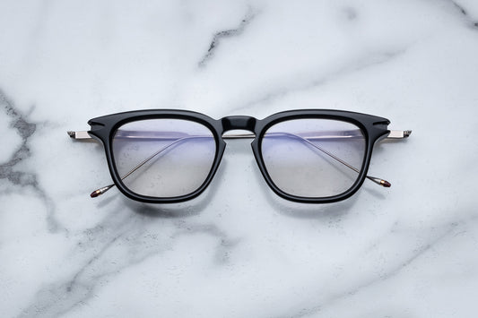 Overhead view of black round eyeglasses