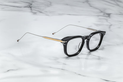 Side view of black round eyeglasses