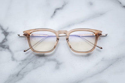 Overhead view of translucent beige round eyeglasses