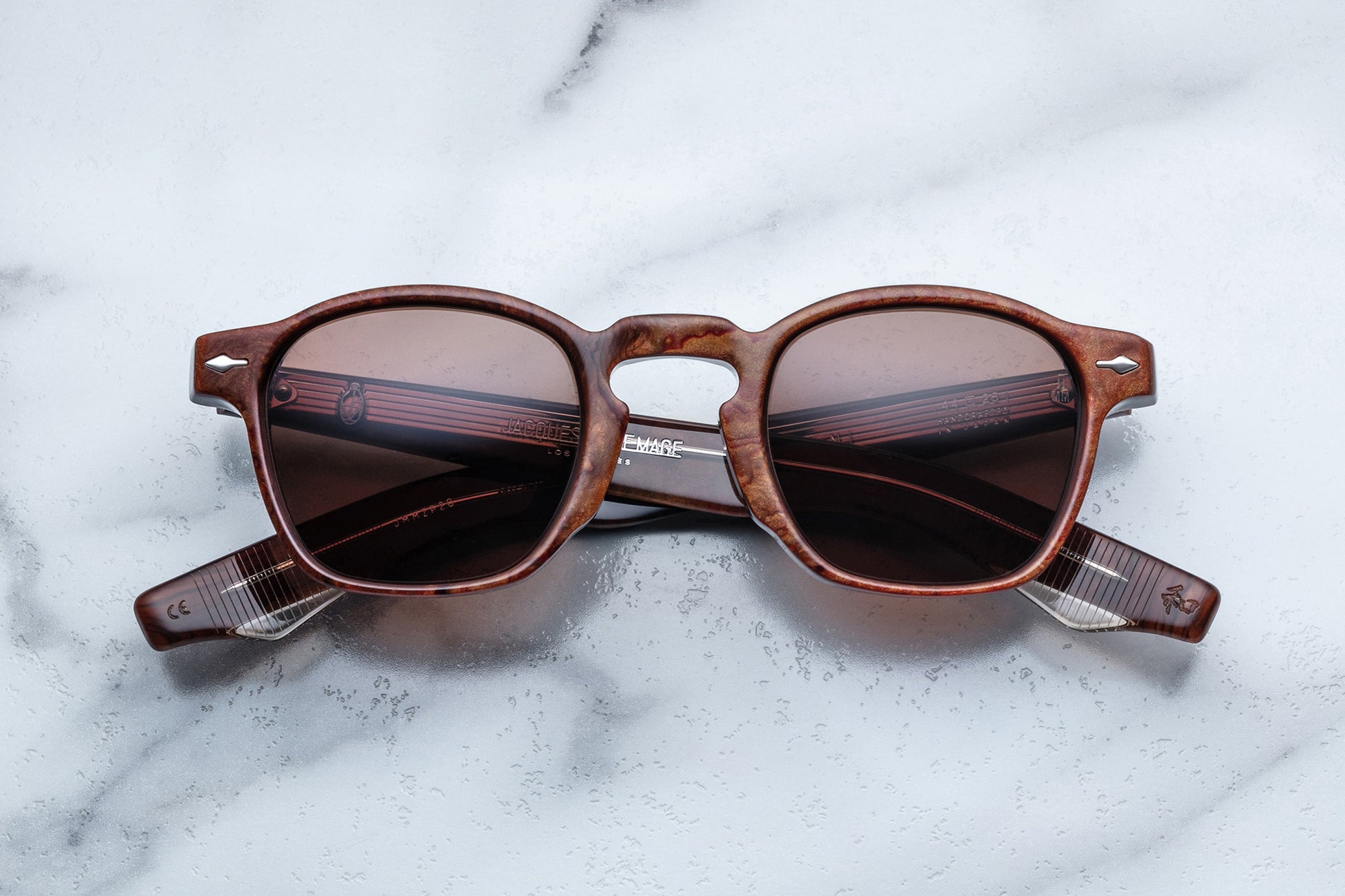 Overhead view of brown rounded rectangular sunglasses with brown lenses