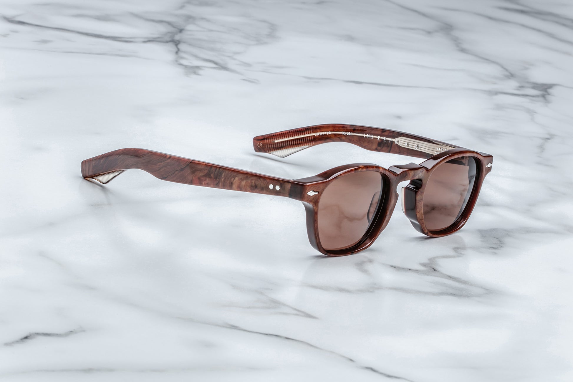 Side view of brown rounded rectangular sunglasses with brown lenses