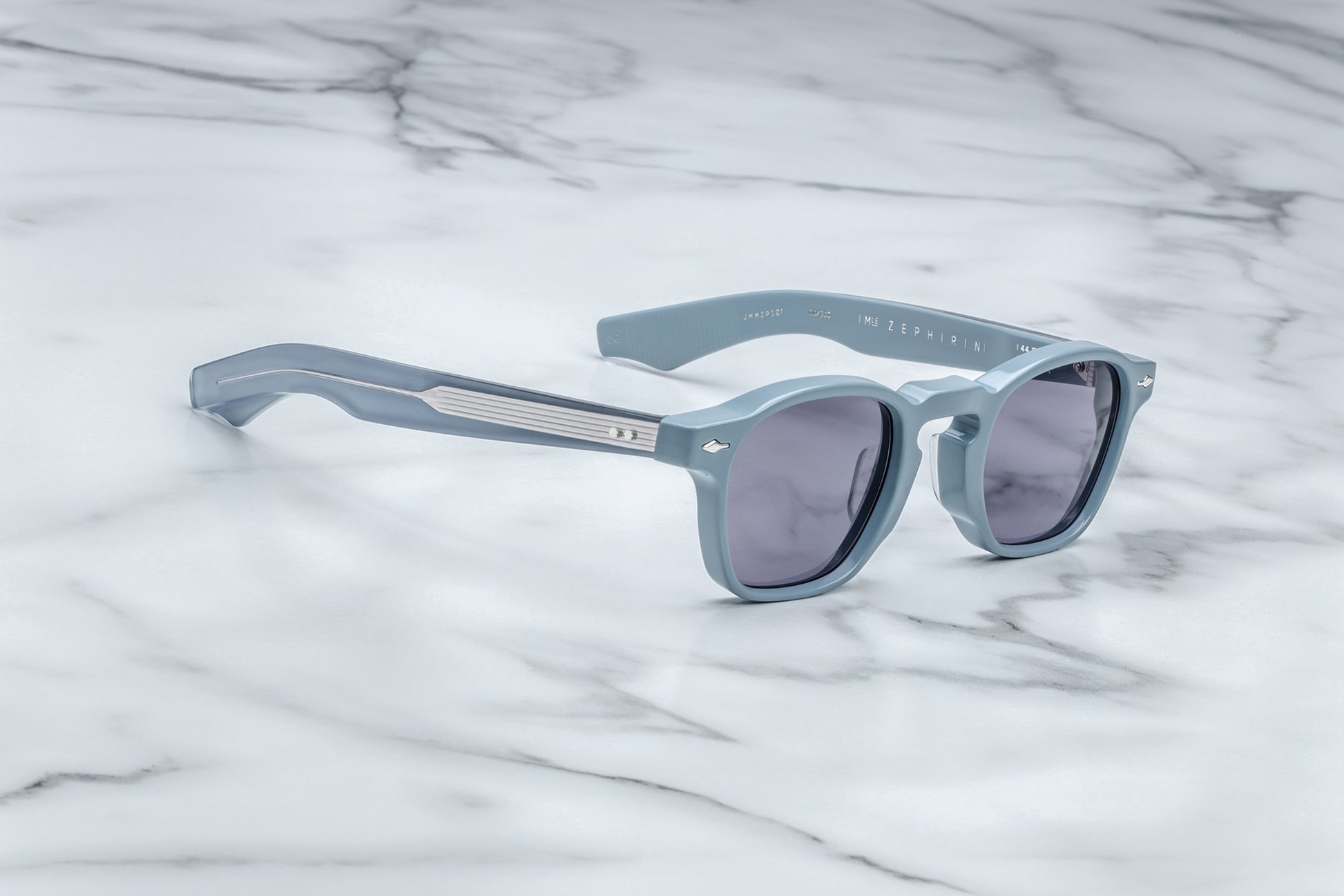 Side view of powder blue rounded rectangular sunglasses with purple lenses